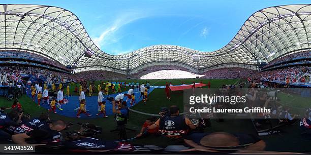 Poland and Ukraine players walk on to the pitch during the UEFA EURO 2016 Group C match between Ukraine and Poland at Stade Velodrome on June 21,...