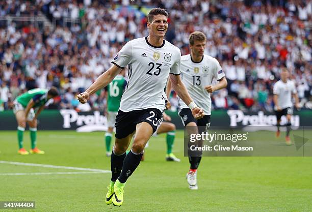 Mario Gomez of Germany celebrates scoring the opening goal during the UEFA EURO 2016 Group C match between Northern Ireland and Germany at Parc des...