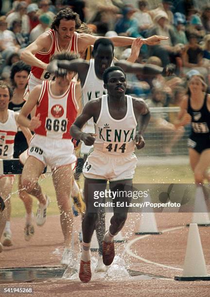 Evans Mogaka of Kenya leading his team-mate Amos Biwatt in the 3000 metres Steeplechase event during the Commonwealth Games in Christchurch, New...