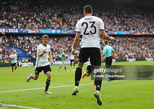 Mario Gomez of Germany celebrates scoring the opening goal during the UEFA EURO 2016 Group C match between Northern Ireland and Germany at Parc des...