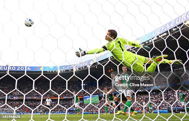 Michael McGovern of Northern Ireland dives for the ball during the UEFA EURO 2016 Group C match between Northern Ireland and Germany at Parc des...