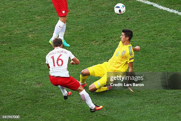 Jakub Blaszczykowski of Poland scores his team's first goal as Yevhen Khacheridi of Ukraine tries to block during the UEFA EURO 2016 Group C match...