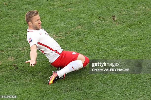 Poland's midfielder Jakub Blaszczykowski celebrates after scoring during the Euro 2016 group C football match between Ukraine and Poland at the...