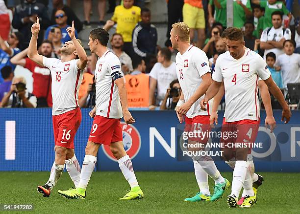 Poland's midfielder Jakub Blaszczykowski celebrates after scoring during the Euro 2016 group C football match between Ukraine and Poland at the...