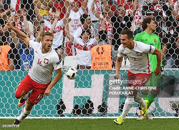 Poland's midfielder Jakub Blaszczykowski celebrates after scoring during the Euro 2016 group C football match between Ukraine and Poland at the...