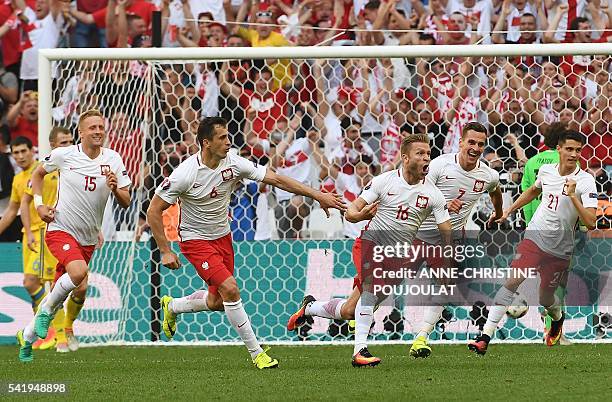 Poland's midfielder Jakub Blaszczykowski celebrates after scoring during the Euro 2016 group C football match between Ukraine and Poland at the...