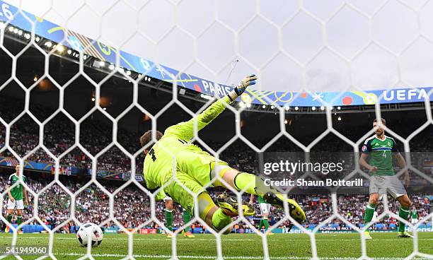 Michael McGovern of Northern Ireland makes a save the header by Mario Gomez of Germany during the UEFA EURO 2016 Group C match between Northern...