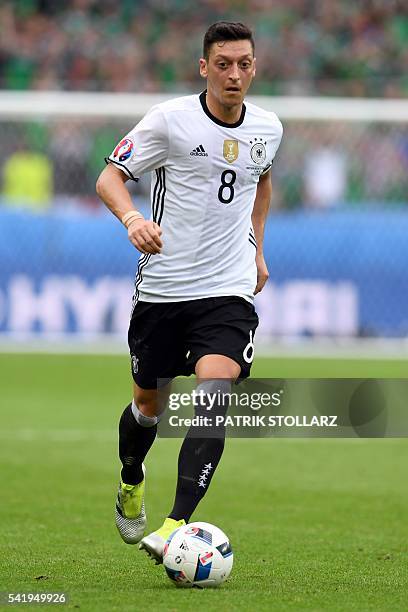 Germany's midfielder Mesut Oezil plays the ball during the Euro 2016 group C football match between Northern Ireland and Germany at the Parc des...