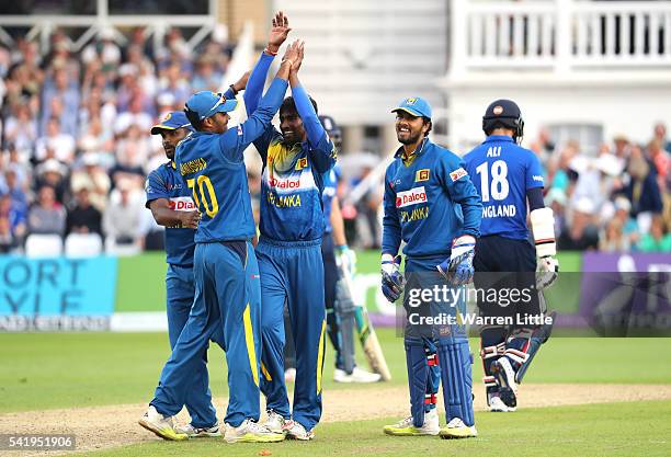 Nuwan Pradeep of Sri Lanka is congratulated after taking the wicket of Moeen Ali of England during of the 1st ODI Royal London One Day match between...