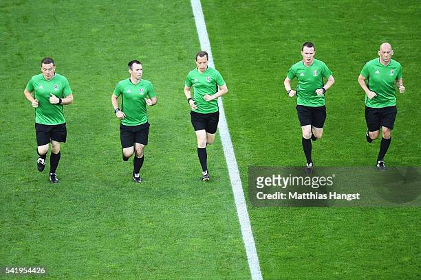 Referee William Collum and assistants warm up prior to the UEFA EURO 2016 Group D match between Czech Republic and Turkey at Stade Bollaert-Delelis...