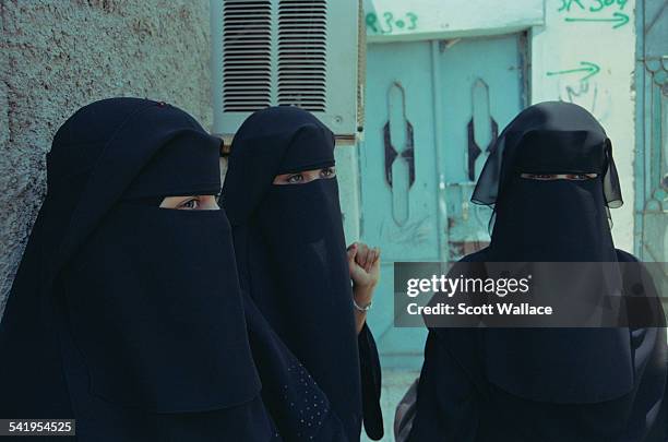 Three women wearing the niqab in Aden, Yemen, 2004.