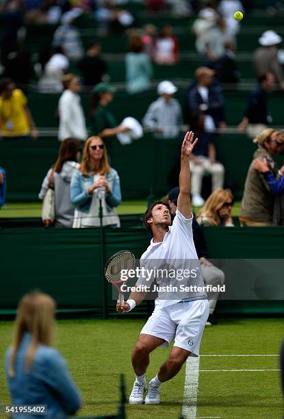 Igor Sijsling of the Netherlands in action against Nils Langer of Germany during the 2016 Wimbledon Qualifying Session on June 21, 2016 in London,...