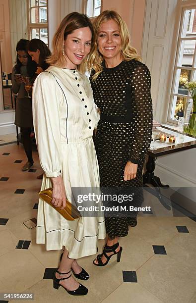 Sienna Guillory and Sienna Miller attend the launch of Wendy Rowe's new book 'Eat Beautiful' hosted by Sienna Miller at Burberry's all day cafe...