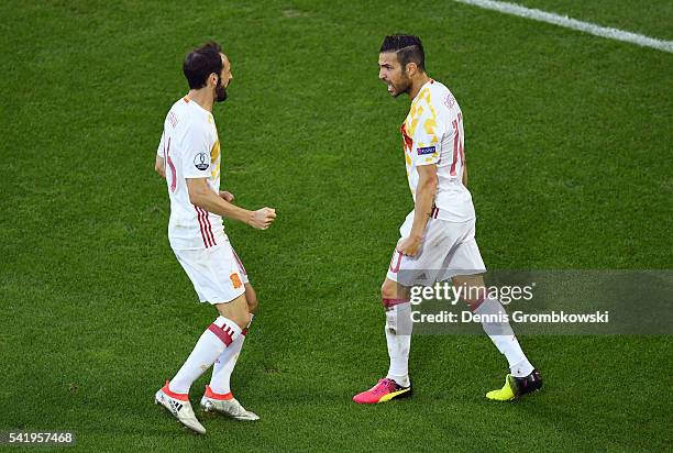 Cesc Febregas of Spain celebrates his team's first goal with his team mate Juanfran during the UEFA EURO 2016 Group D match between Croatia and Spain...