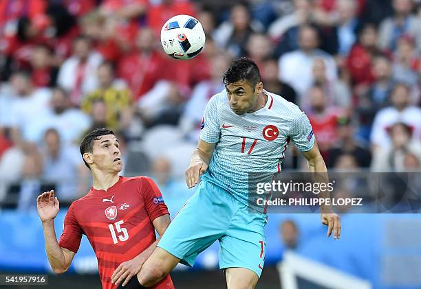 Czech Republic's midfielder David Pavelka vies with Turkey's forward Burak Yilmaz during the Euro 2016 group D football match between Czech Republic...