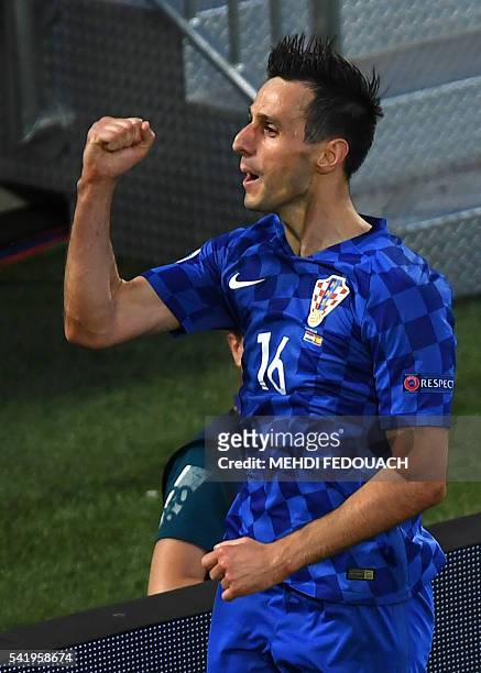 Croatia's forward Nikola Kalinic celebrates his equalising goal during the Euro 2016 group D football match between Croatia and Spain at the Matmut...