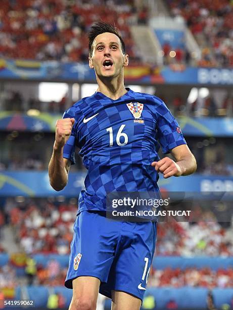 Croatia's forward Nikola Kalinic celebrates after scoring his team's first goal during the Euro 2016 group D football match between Croatia and Spain...