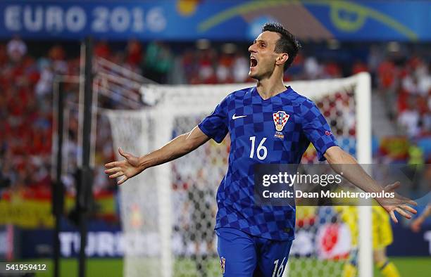 Nikola Kalinic of Croatia celebrates scoring his team's first goal during the UEFA EURO 2016 Group D match between Croatia and Spain at Stade Matmut...