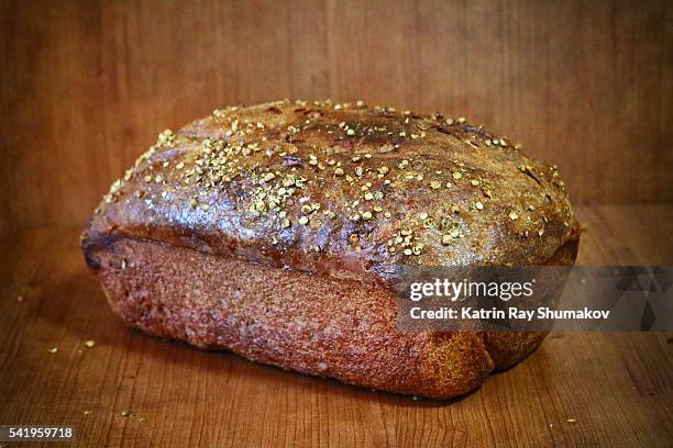 rectangular loaf of homemade rye bread - rye bread loaf stock pictures, royalty-free photos & images