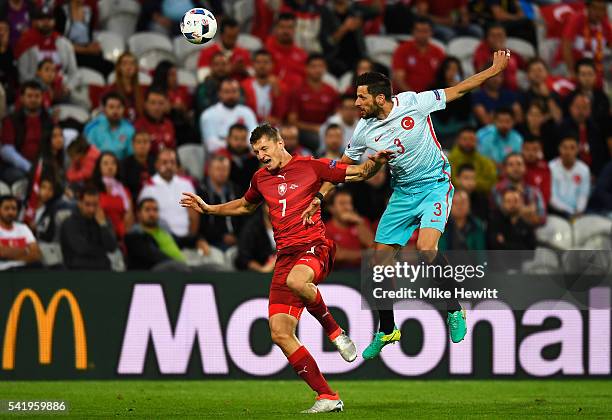 Tomas Necid of Czech Republic is tackled by Hakan Balta of Turkey during the UEFA EURO 2016 Group D match between Czech Republic and Turkey at Stade...