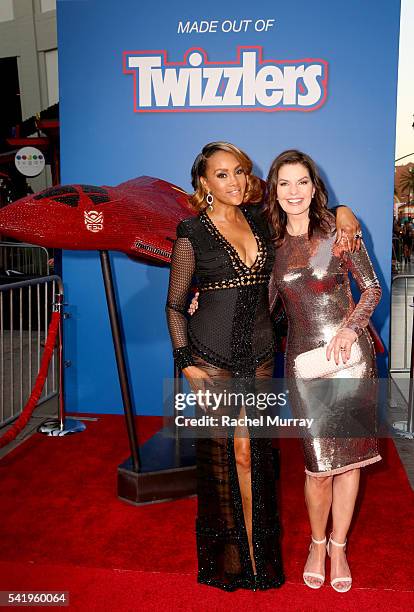 Take a bite out of this: Vivica A. Fox and Sela Ward, co-stars of Fox's Independence Day: Resurgence, unveil a replica of the film's Hybrid Fighter...