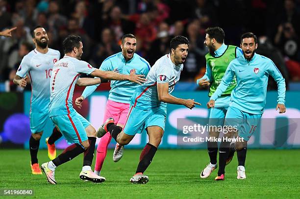 Ozan Tufan of Turkey celebrates scoring his team's second goal during the UEFA EURO 2016 Group D match between Czech Republic and Turkey at Stade...