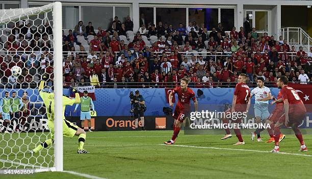 Turkey's midfielder Ozan Tufan scores a goal during the Euro 2016 group D football match between Czech Republic and Turkey at Bollaert-Delelis...