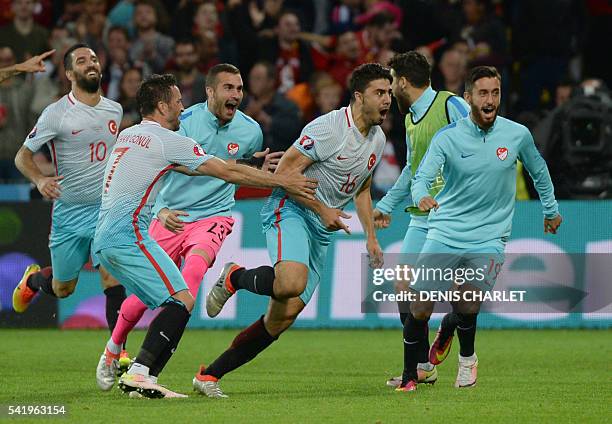 Turkey's midfielder Ozan Tufan celebrates after scoring a goal during the Euro 2016 group D football match between Czech Republic and Turkey at...