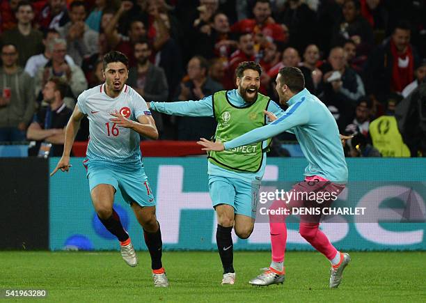 Turkey's midfielder Ozan Tufan celebrates after scoring a goal during the Euro 2016 group D football match between Czech Republic and Turkey at...