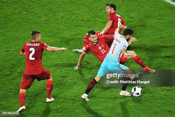 Olcay Sahan of Turkey runs through the Czech Republic players during the UEFA EURO 2016 Group D match between Czech Republic and Turkey at Stade...