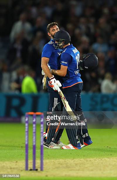 Lian Plunkett of England is congratulated by team mate Chris Woakes after hitting a a six off the last ball the tie the 1st ODI Royal London One Day...