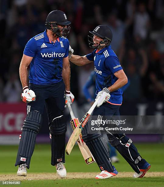 Liam Plunkett of England celebrates with Chris Woakes after hitting six runs from the final ball to tie the 1st ODI Royal London One Day match...