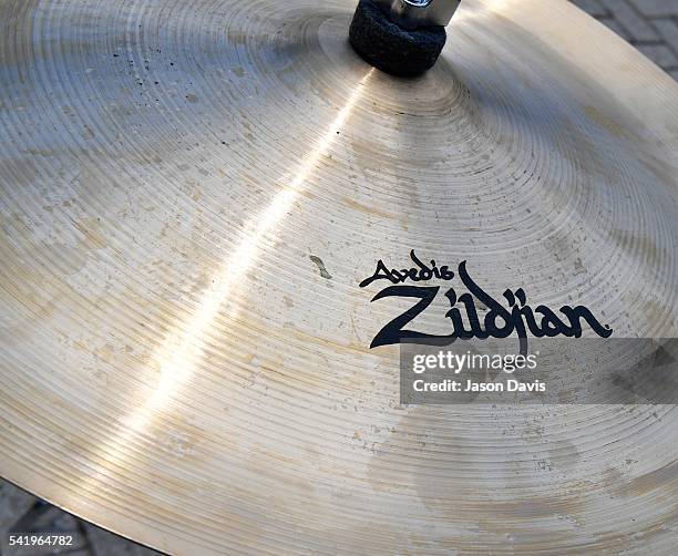 Participant cycles and plays the cymbals during the Zildjian Cymbal Jungle outside of the Schermerhorn Symphony Center as part of Make Music Day on...