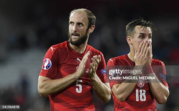 Czech Republic's defender Roman Hubnik and Czech Republic's midfielder Josef Sural react at the end of the Euro 2016 group D football match between...