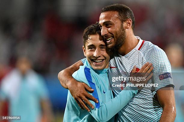 Turkey's forward Emre Mor and Turkey's forward Cenk Tosun celebrate their team's victory at the end of the Euro 2016 group D football match between...