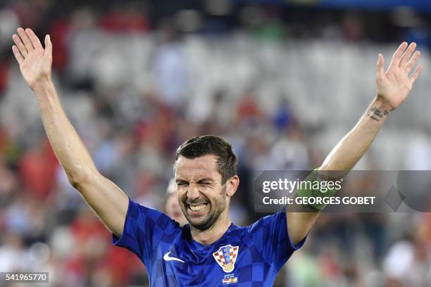 Croatia's defender Darijo Srna greets the fans following their victory during the Euro 2016 group D football match between Croatia and Spain at the...