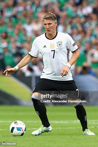 Bastian Schweinsteiger of Germany runs with the ball during the UEFA EURO 2016 Group C match between Northern Ireland and Germany at Parc des Princes...
