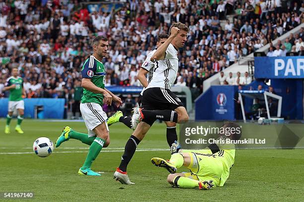 Michael McGovern of Northern Ireland denies Thomas Muller of Germany during the UEFA Euro 2016 Group C match between the Northern Ireland and Germany...