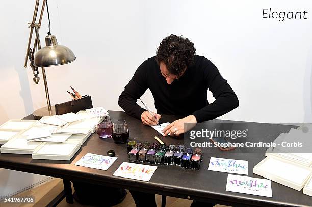 Nicolas Ouchenir demonstrates calligraphie during the Montblanc Urban Spirit Launch on June 21, 2016 in Paris, France.