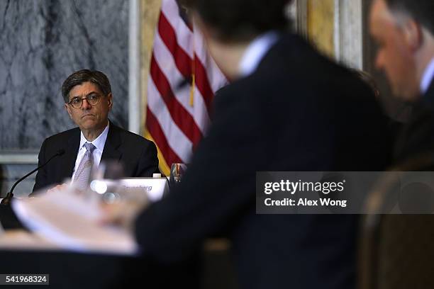 Secretary of the Treasury Jacob Lew listens during a meeting of the Financial Stability Oversight Council June 21, 2016 in Washington, DC. The...