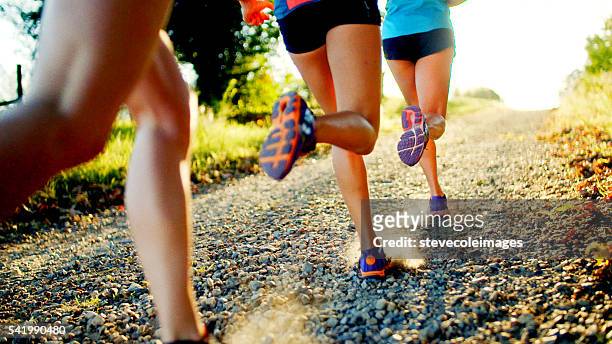 friends running - running stock pictures, royalty-free photos & images