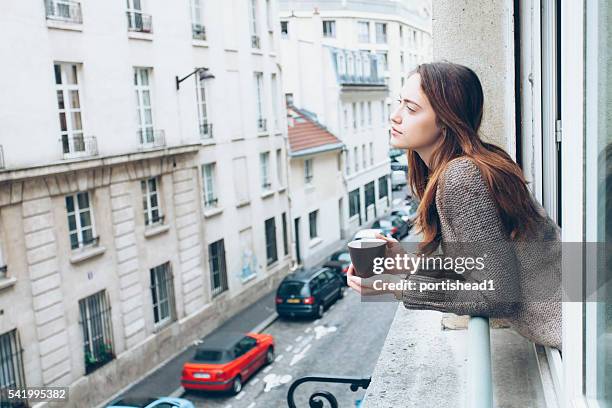 young woman drinking coffee - window sill and side view stock pictures, royalty-free photos & images