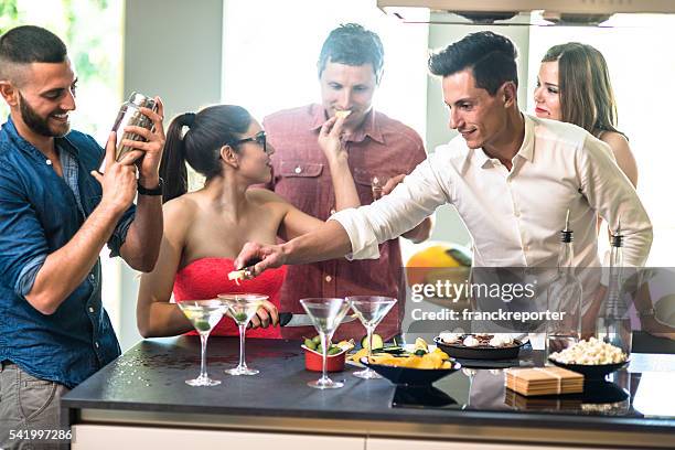 group of friends toasting with drinks - cocktail party stockfoto's en -beelden