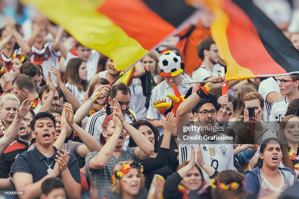 German fan supporters cheering shouting for soccer team