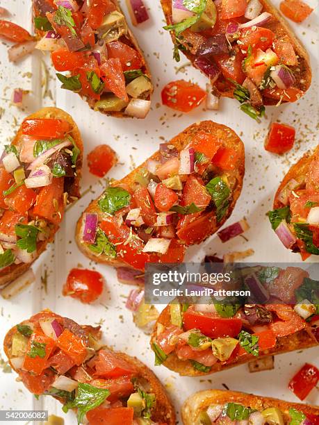 bruschetta on toasted baguettes - bruschetta stock pictures, royalty-free photos & images