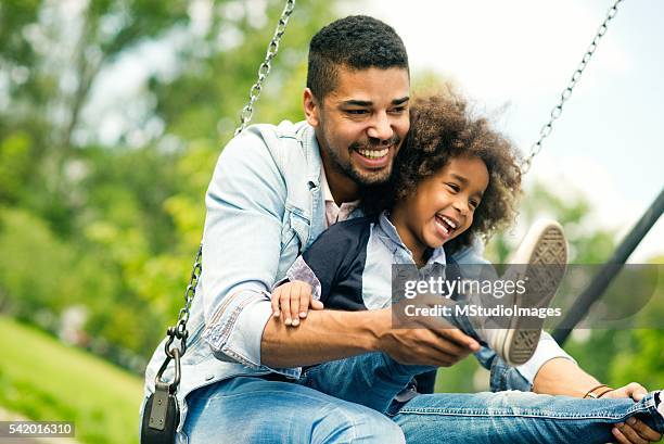 having fun with daughter. - public park playground stock pictures, royalty-free photos & images