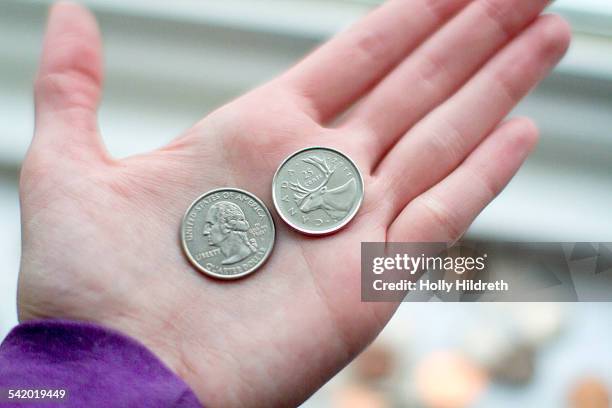 currency - coin in palm of hand stock pictures, royalty-free photos & images