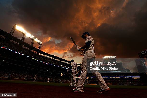 Yoenis Cespedes and Neil Walker of the New York Mets get ready t bat in the fourth inning against the Kansas City Royals at Citi Field on June 21,...