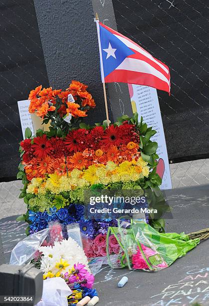 Flowers for the victims of the Pulse Nightclub shooting lie at the front of the nightclub on June 21, 2016 in Orlando, Florida. The Orlando community...