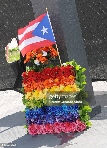 Flowers for the victims of the Pulse Nightclub shooting lay at the front of the nightclub on June 21, 2016 in Orlando, Florida. The Orlando community...